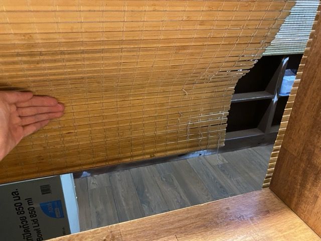 Their wooden blind pushed to reveal their secret tunnel